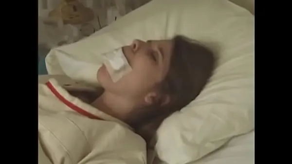 HD Pretty brunette in Straitjacket taped mouth tied to bed hospital วิดีโอยอดนิยม